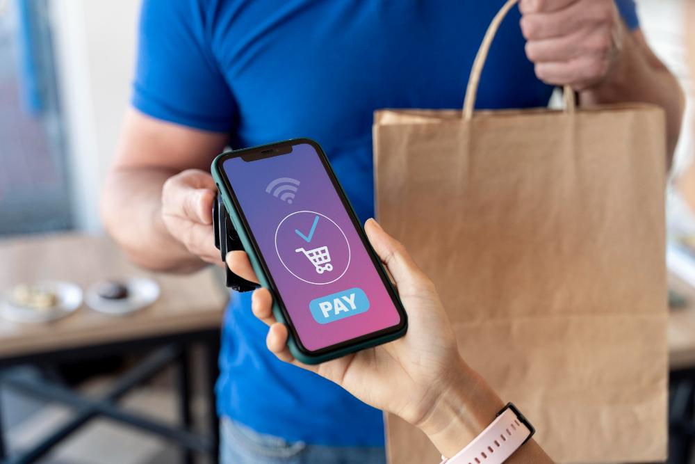 Phone with mobile payment confirmation displayed.