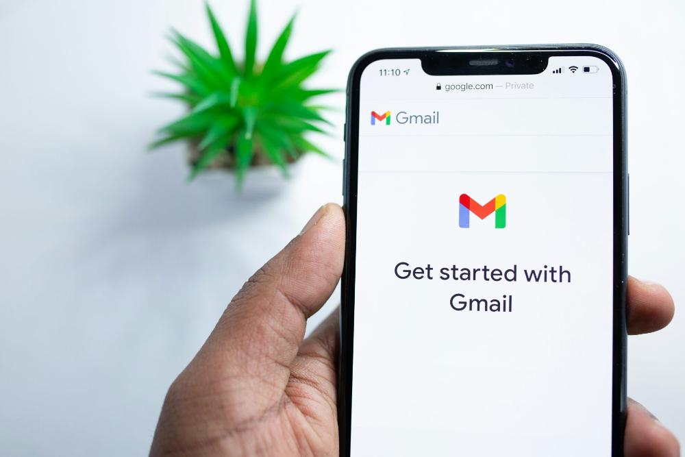 Mobile phone screen displaying Gmail login.